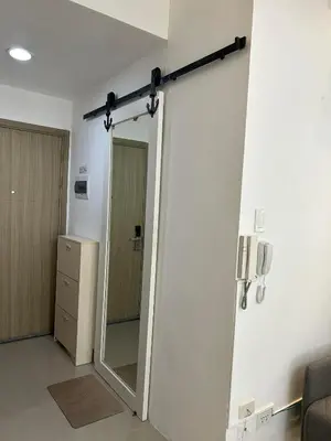 a room with a mirror and a door in a room at Casa Zahra in Manila