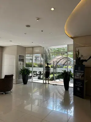 a person standing in the lobby of a building at Casa Zahra in Manila