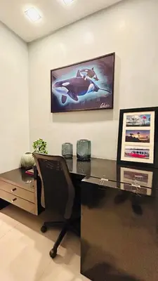 an office with a desk with a chair and a picture on the wall at BEAUTIFUL and SPACIOUS 2 REAL BEDROOMS 2 BATHROOMS IN BGC GLOBAL CITY in Manila