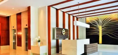 a lobby with a television and a painting on the wall at Newly Renovated 2-storey Loft at Greenbelt 1 in Manila