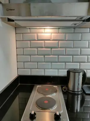 a stove top with a pot on top of it at Casa Florentino in Manila