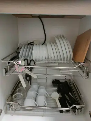 a drawer filled with white dishes and utensils at Casa Florentino in Manila