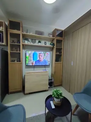 a living room with a flat screen tv in a room at Casa Florentino in Manila