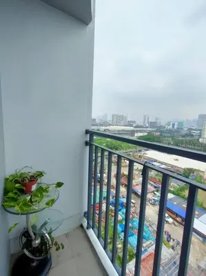 a balcony with a view of a construction site at Casa Florentino in Manila