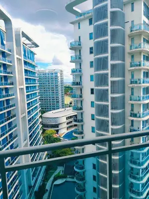 a view from a balcony of tall buildings at CHILL City Escapes at Azure Urban Residences in Manila