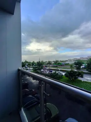 a balcony with a view of a parking lot at SMDC StayWise Space in Manila