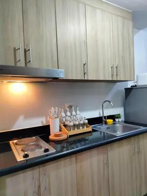 a kitchen with a sink and a counter top at SMDC StayWise Space in Manila