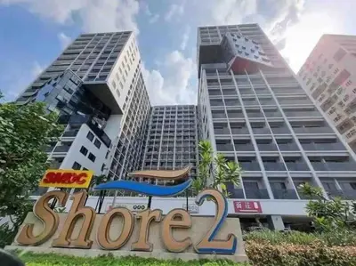 a store sign in front of two tall buildings at Casa Florentino in Manila