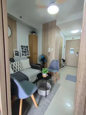 a living room with a couch and a table at Casa Florentino in Manila