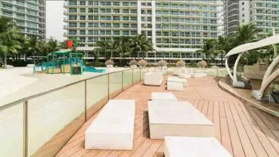 a group of white benches sitting on top of a building at Azure Urban Residences Bahamas & One bedroom in Manila