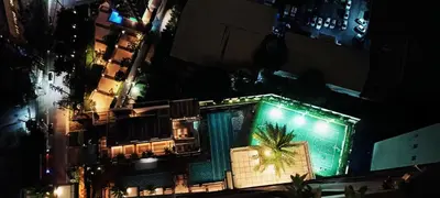 an overhead view of a building with a palm tree at Condominium in Manila