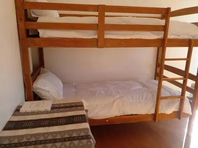 a bedroom with two bunk beds in a room at Taguig Apartment Near ARCA South in Manila