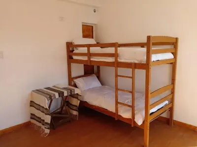 a couple of bunk beds in a room at Taguig Apartment Near ARCA South in Manila