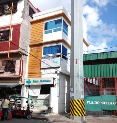 a building on a city street with at Taguig Apartment Near ARCA South in Manila