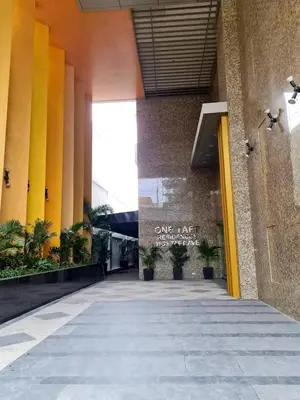 a hallway of a building with yellow and orange columns at One taft residence taft avenue City Land manila in Manila