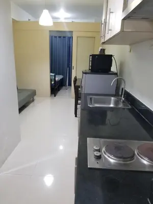 a kitchen with a sink and a counter top at Sea residence Family Group Affordable staycation in Manila