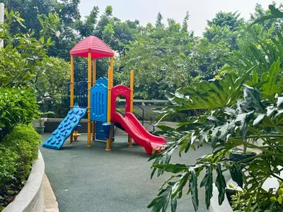 a playground with a slide and a slideintend at Enter Home McKinley with a View in Manila