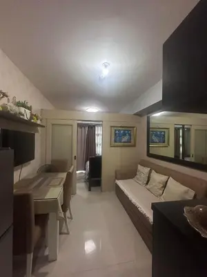a small room with a bed and a desk in it at Sea Residences Tower A 7th floor facing pool by Richnells your cozy oasis in Manila