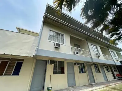 a white house with windows and a balcony at Lawton Residences Studio Room 2H in Manila