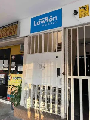 a store with a sign on the front of a building at Lawton Residences Studio Room 2K - 4 pax in Manila