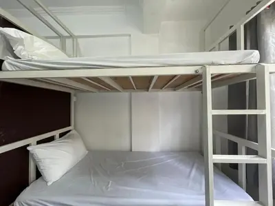 a couple of bunk beds in a room at Lawton Residences Studio Room 3D - 4 pax in Manila