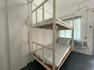 a bedroom with a bunk bed in a room at Lawton Residences Studio Room 3D - 4 pax in Manila