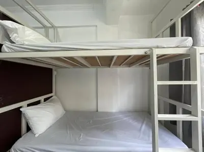 a couple of bunk beds in a room at Lawton Residences Studio Room 3C - 4 pax in Manila
