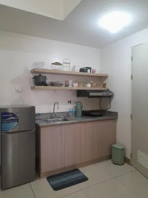 a kitchen with a sink and a counter top at SMDC 2Bedroom SM Southmall in Manila