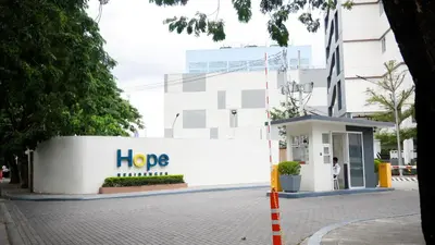 a sign that says hope in front of a building at Warm & Cozy Retreat near SM City Trece Martires in Trece Martires
