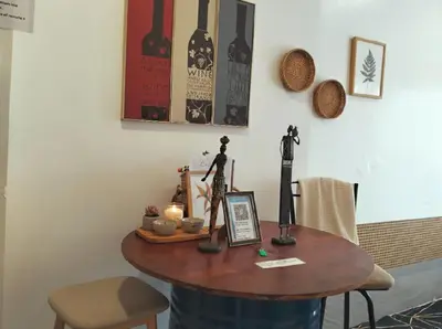 a table with some figurines on top of it at Ortigas Greenfield Cozy Lodge in Manila