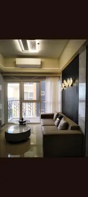 a living room with a couch and a table at One Winstar Realty Corp in Manila