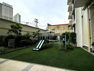 a playground in the middle of a building at Fairlane Residences in Manila