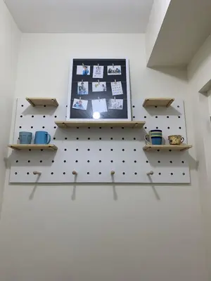 a shelf with a laptop on top of a wall at Fairlane Residences in Manila