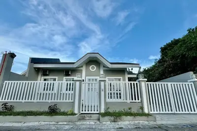a white fence in front of a house at Casa Leonardo-Bel Air 4 in Santa Rosa