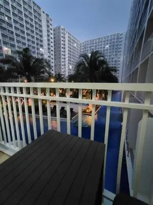a balcony with a view of the ocean and buildings at Near MOA at SHORE RESIDENCES 1BR with balcony -unlimited WIFI in Manila