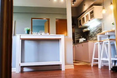 a kitchen with a counter with a sink in it at Best Deal! Cozy and Minimalist 2BR nr Airport in Manila