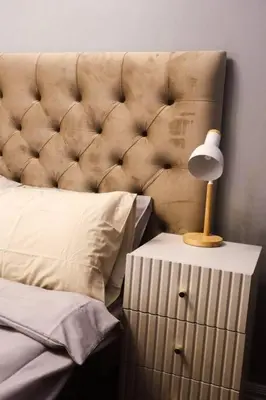 a lamp on a night stand next to a bed at Best Deal! Cozy and Minimalist 2BR nr Airport in Manila