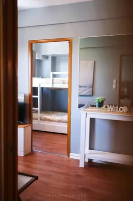 a room with a mirror and a bunk bed at Best Deal! Cozy and Minimalist 2BR nr Airport in Manila