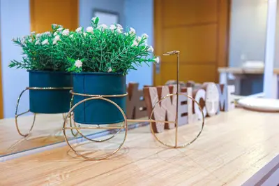 a pair of glasses sitting on a table with plants at Best Deal! Cozy and Minimalist 2BR nr Airport in Manila