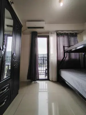 a bedroom with a bunk bed and a balcony at Shore 1 Residences - 1 Bedroom with Balcony in Manila
