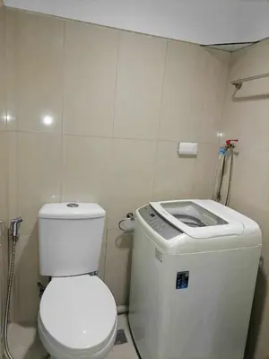 a bathroom with a toilet and a water tank at spacious 1 br fully furnished condo in Manila