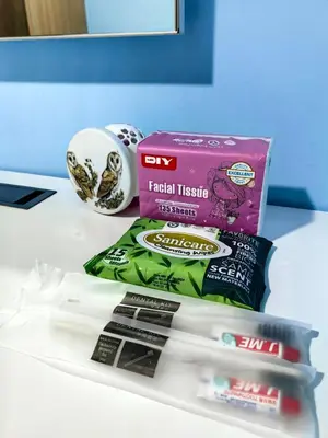 a table with some toothbrushes and a box of facial tissue at VM Staycation Grace Residence Taguig in Manila