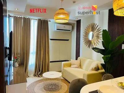 a living room with a couch and a table at HIGHLY RECOMMENDED La Nooq MNL - Cozy 1BR Skyline view in Mandaluyong in Manila