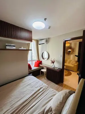 a bedroom with a bed and a large mirror at HIGHLY RECOMMENDED La Nooq MNL - Cozy 1BR Skyline view in Mandaluyong in Manila