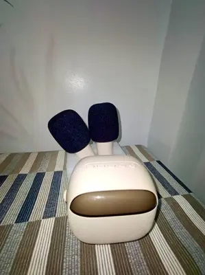 a tv sitting on the floor with two speakers at 1 Bedroom with Balcony Near MOA in Manila