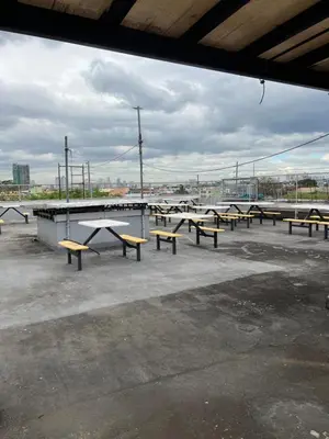 a group of benches sitting in a parking lot at 1 Bedroom Apartment in Central Makati in Manila