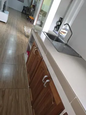 a kitchen with a sink and a counter top at 1 Bedroom Apartment in Central Makati in Manila