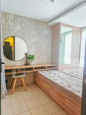 a room with a mirror and a bed and a desk at Instragamable2BR near Bridgetown in Manila