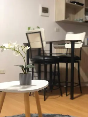 a table with a potted plant on it in a room at Your Home Away From Home in Imus
