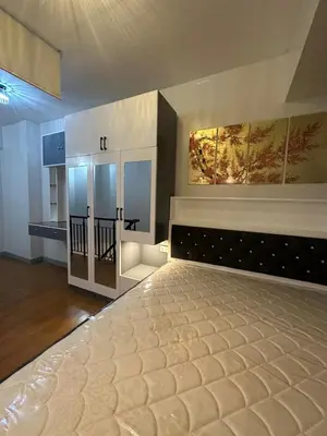 a bedroom with a large bed in a room at Newly Reneuvated Fully Furnished Condo Apartment in the Heart of Mandaluyong in Manila